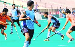 A match in progress at the Hockey Stadium in Chandigarh on Monday. 