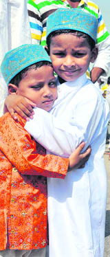 Children greet each other on Id in Gurgaon on Monday.