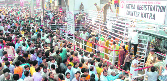 A rush of devotees outside the registration counter for yatra to pay obeisance at the Mata Vaishno Devi shrine on Navratras in Katra.