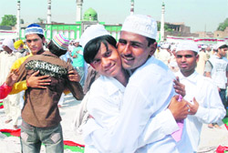 People greet each other on the occasion of Id at the Jama Masjid in Bathinda 