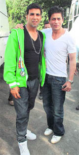 Actor Shah Rukh Khan (R) and Akshay Kumar pose for a picture on the set of Akshay's upcoming movie Blue.