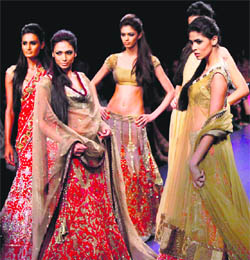 Models display designer Manish Malhotra's creations during the Lakme Fashion Week, in Mumbai.