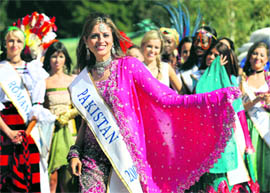 Pakistans Mariyah Moten, a participant at the Miss Intercontinental-2009 beauty contest, displays a traditional costume during visit to Dudutki museum complex in Belarus on Sunday. The final of the contest will be held on September 27.
