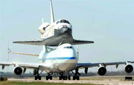 Space Shuttle Discovery piggybacking on a modified Boeing-747 taxis and prepares to take off on the next leg of its trip across the country at Rick Husband Amarillo International Airport on Sunday.
