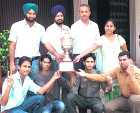 Members of the winning team strike a pose in Patiala