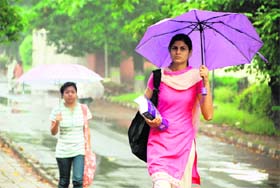 PU girls enjoy the rain in the morning while going to their classes