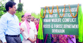 RBS Rawat, Uttarakhand Principal Chief Conservator of Forests, along with Dr Anil Joshi of HESCO, inaugurates the experiment to improve wildlife habitat at Shuklapur village near Dehradun on Tuesday.