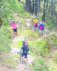 Bikers pass through a tough terrain in the interior of Shimla district during MTB-2008