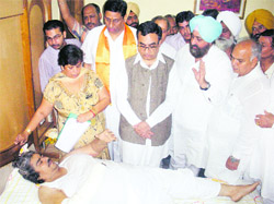 Union Minister of State for Home Ajay Maken (second from left), Congress MP Partap Singh Bajwa and acting PPCC chief Mohinder Singh Kaypee enquire after Pawan Kumar Pamma, Congress municipal councillor, in Batala
