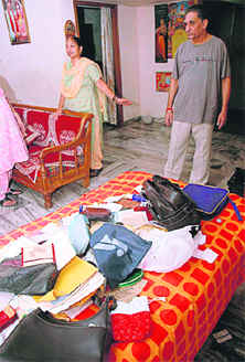 Hem Raj and his wife show their ransacked house in Sector 46 in Chandigarh on Wednesday.