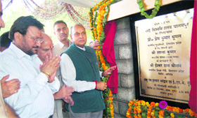 Chief Minister Prem Kumar Dhumal laying the foundation stone of Sri SAI University at Palampur on Wednesday.