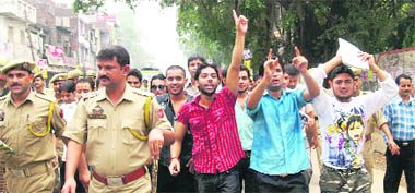 Students raise slogans against the state government demanding the establishment of a Central varsity in Jammu on Wednesday.