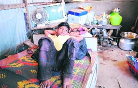 Oscar-winning film Slumdog Millionaires child star Azharuddin Ismail (11) in his shanty in Mumbai
