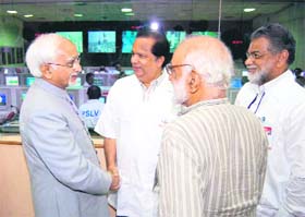 Vice-president Mohammad Hamid Ansari (left) shakes hands with Indian Space Research Organisation chairman G Madhavan Nair after the PSLV-C14 launch from the Satish Dhawan Space Centre in Sriharikota