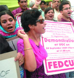 Teachers protest against the UGC's stand on new regulations on service conditions for teachers in New Delhi