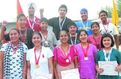 Winners of the shooting championship give a happy pose. 