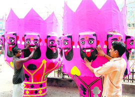 As Dasehra approaches, artisans give the finishing touches to an effigy of Ravana in Amritsar. 