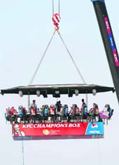 Spectators watch from a suspended platform during the ICC Champions Trophy group match between South Africa and New Zealand on Thursday. 