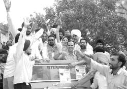 Bhagat Singh, an Independent, with his supporters after filing his papers at Kalka on Friday.