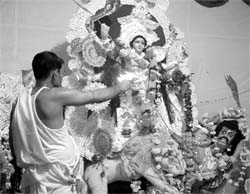 A devotee offers prayers on the concluding day of Durga Pooja at Patiala on Friday.