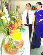 Students participate in flower arrangement competition on the occasion of the World Tourism Day at Dr Ambedkar Insitute in Chandigarh.