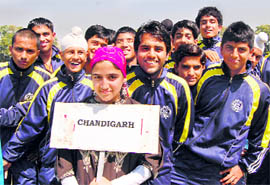 Chandigarh cricket team pose for a photograph during the inauguration of the 55th National School Cricket Championship in Srinagar on Friday.