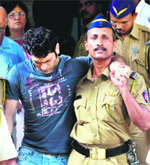Actor Shiney Ahuja being taken to a court in Mumbai 