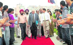University Institute of Engineering and technology (PU) students welcome Union HRD Minister Kapil Sibal and Vice-Chancellor RC Sobti. 