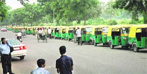 Auto-rickshaw drivers wait for their turn at LPG filling station at Sector 34 in Chandigarh on Saturday.