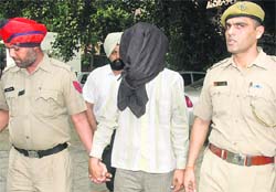 BKI activist, Harpreet Singh, being produced in a Mohali court on Saturday. Tribune photo: Parvesh Chauhan