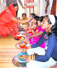 Girls being worshipped during Durga Ashtmi in Ludhiana on Saturday. 