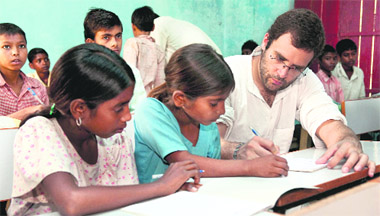 Rahul Gandhi gives tips to students at a school in Rampur Devman village of Shravasti district in UP