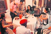 A police official counts gambling money seized during a raid conducted on a house in Sector 19, Chandigarh,on late Sunday evening. 