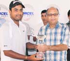 Anirban Lahiri with the trophy and prize money cheque after winning the Rs 30 lakh Haryana Open PGTI event at the Panchkula Golf Club on Sunday. 