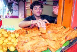 Egg pakoras and fried fish at 'Taara Machi' shop in Dehradun.