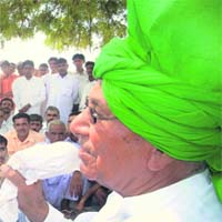 INLD chief Om Prakash Chautala addresses villagers of Kagdana in the Ellenabad constituency on Sunday.