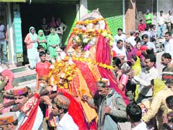 The decorated palanquin of Goddess Hadimba Devi on its way to Kullu on Sunday. 