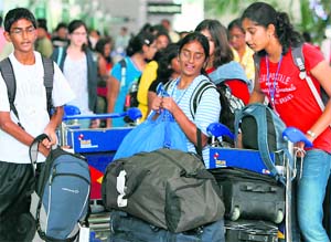 Stranded passengers at the IGI Airport in New Delhi on Sunday.