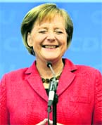Angela Merkel, German Chancellor and leader of the conservative Christian Democratic Union party, reacts after first exit polls in Berlin on Sunday. She appears to have won enough votes to form a centre-right government.