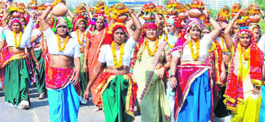 Women take part in a kalash yatra, a day after the end of the Navratri festival, in a Gargaon village on Monday.