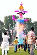 An effigy of Ravana goes up in flames in Srinagar on Monday. 