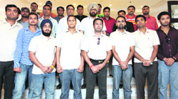 Members of the Punjab Deaf Cricket team strike a pose before their departure in Ludhiana