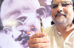 Tushar Gandhi, great grandson of Mahatma Gandhi, holds a Montblanc Mahatma Gandhi Memorial Edition 3000 fountain pen during a launch ceremony in Mumbai 