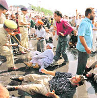 The police lathicharges protesting SRTC employees outside the civil secretariat in Srinagar on Tuesday