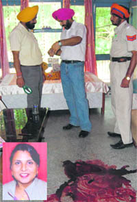 Policemen at the residence of Manju (inset) where she was murdered in Ludhiana on Tuesday.
