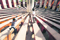 Children play inside Jantar Mantar, a collection of architectural astronomical instruments, in New Delhi
