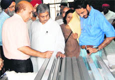 Punjab Forest Minister Tikshan Sud (centre) examines the forest complex construction site in Sector 68, Mohali, on Tuesday.