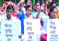 Children and their parents demonstrate under the banner of the All India Save Education Committee at Jantar Mantar against alleged destruction of education system in New Delhi on Wednesday.