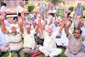 UP IN ARMS: Members of the Pensioners Association protest in front of the DC office in Jammu