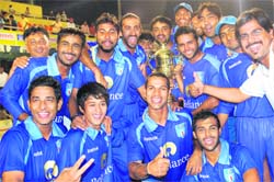 The Reliance-I team celebrate after winning the JP Atray Tournament at the PCA Stadium in Mohali, on Wednesday. 